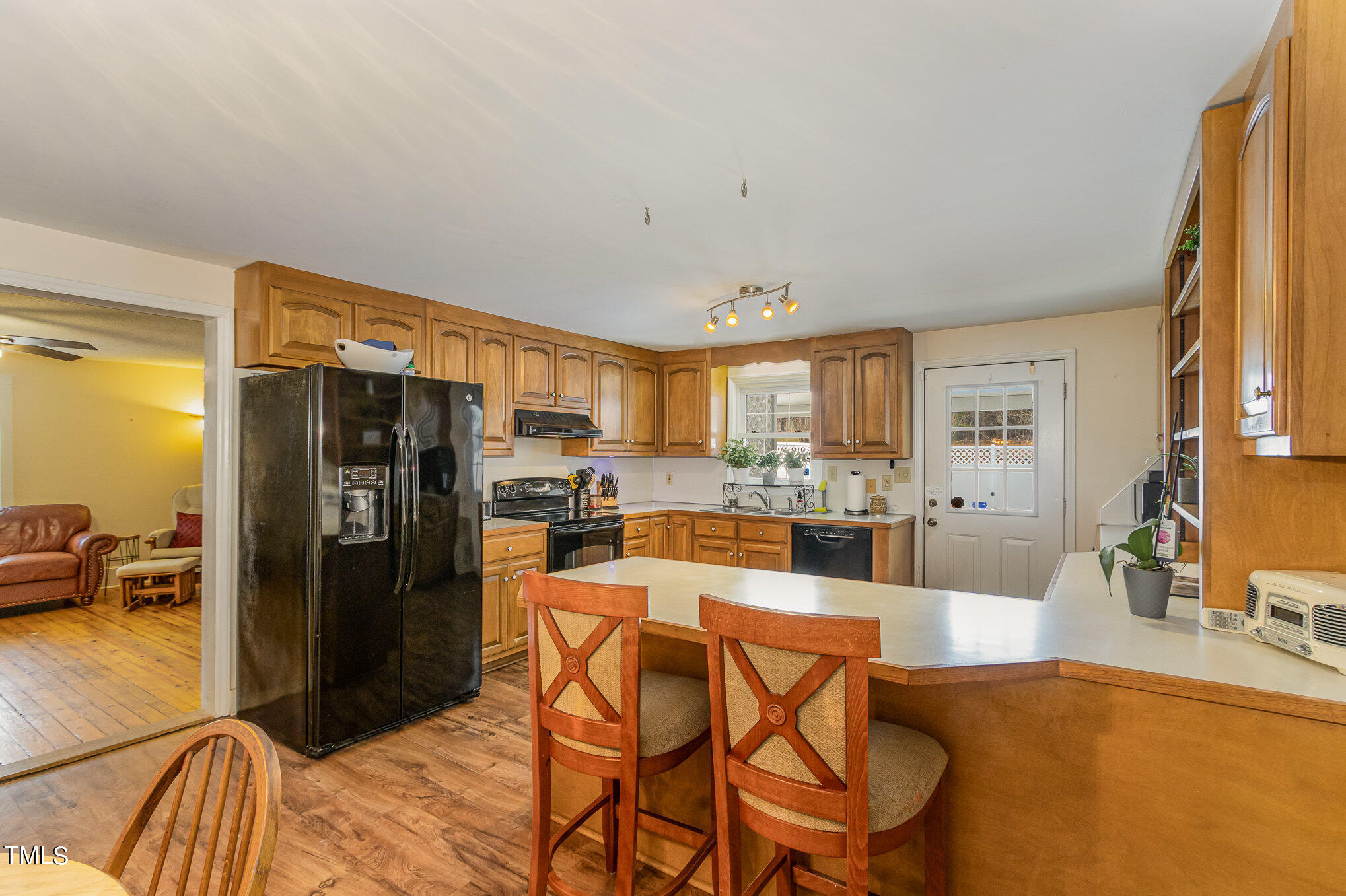 804 Bahama Road Bahama, NC 27503 - Photo 20 of 80 a kitchen with stainless steel appliances granite countertop a refrigerator and a sink