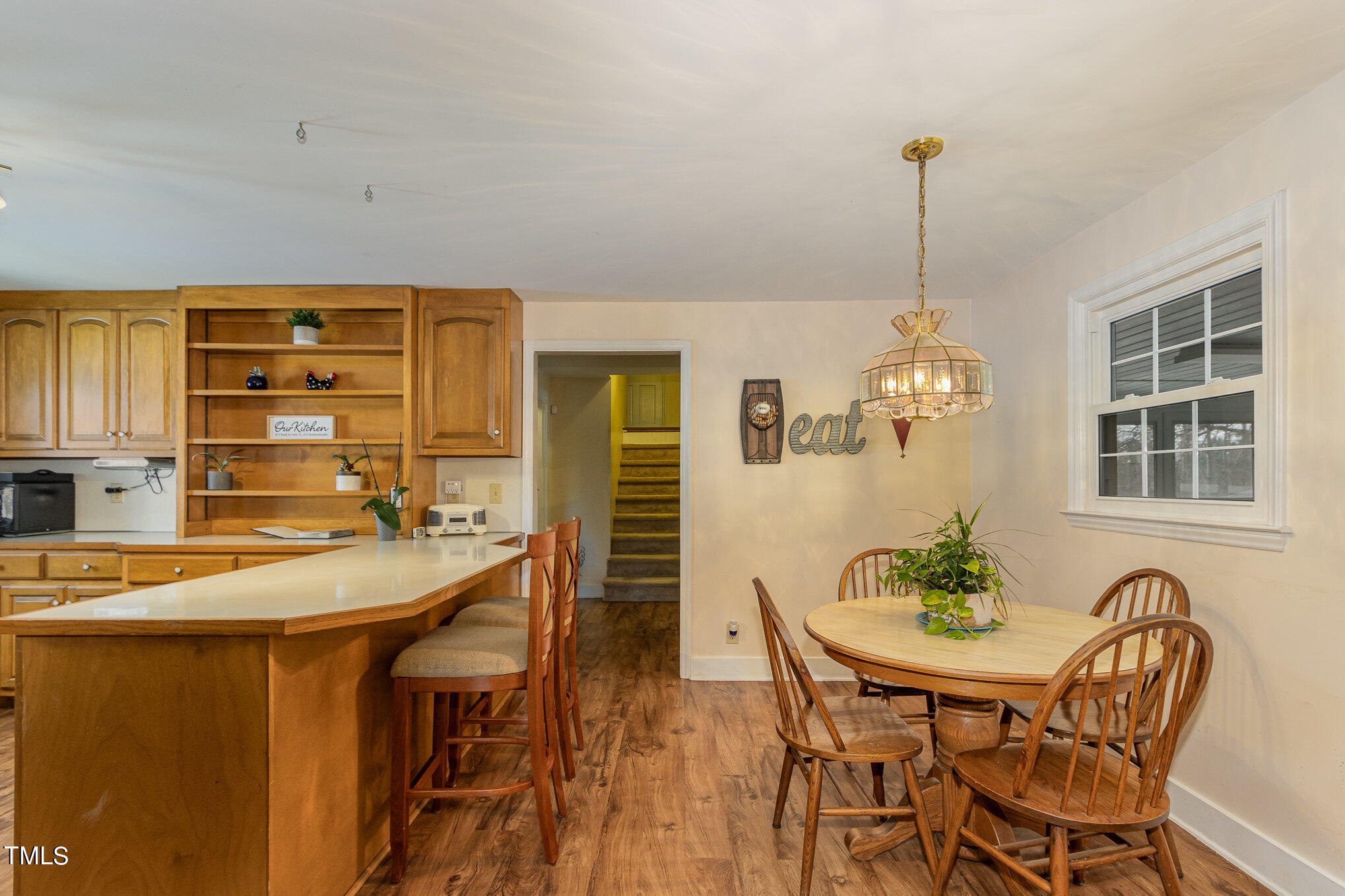 804 Bahama Road Bahama, NC 27503 - Photo 21 of 80 a dining room filled chandelier and wooden floor