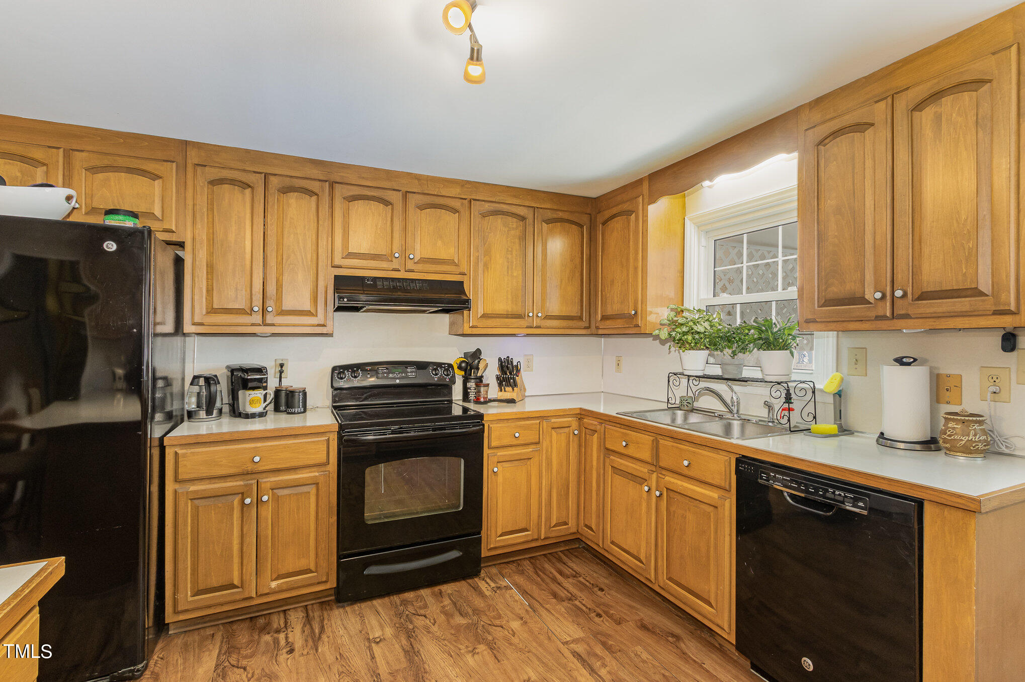 804 Bahama Road Bahama, NC 27503 - Photo 23 of 80 a kitchen with a stove a sink and a microwave