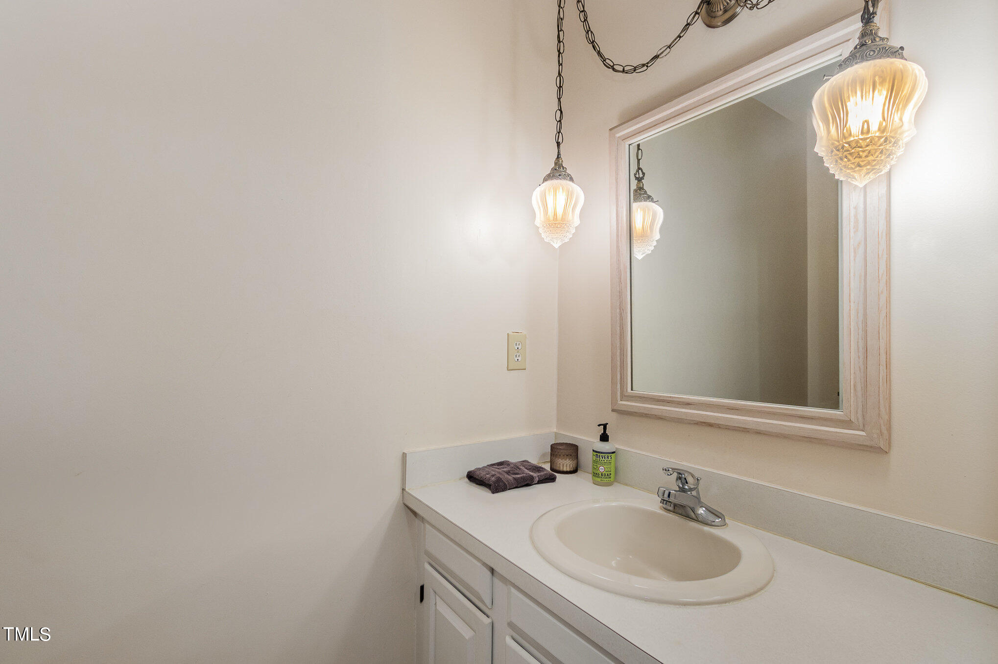 804 Bahama Road Bahama, NC 27503 - Photo 26 of 80 a bathroom with a sink and a mirror