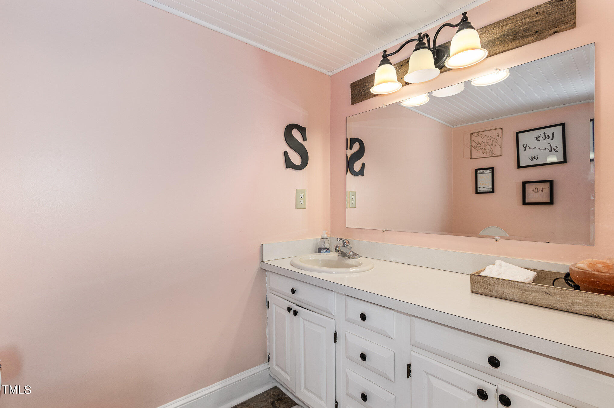 804 Bahama Road Bahama, NC 27503 - Photo 31 of 80 a bathroom with a sink and a mirror