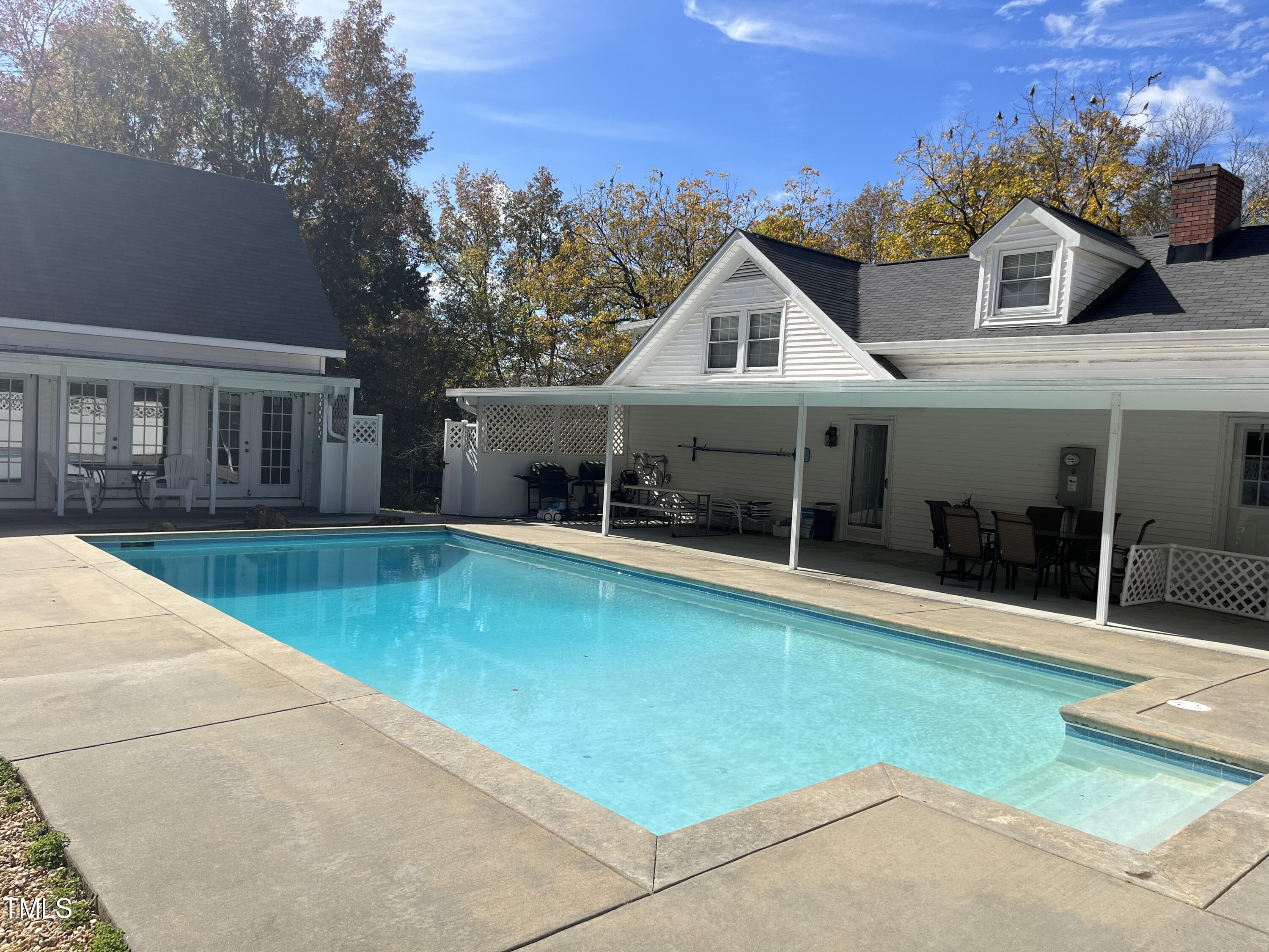 804 Bahama Road Bahama, NC 27503 - Photo 58 of 80 a view of a house with swimming pool and porch