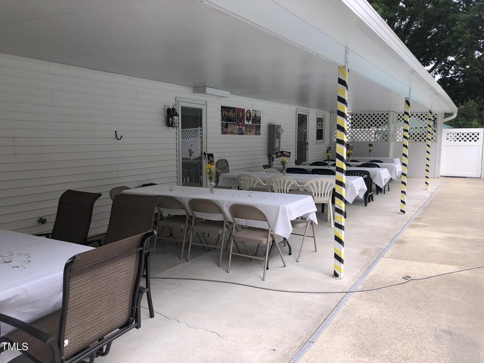 804 Bahama Road Bahama, NC 27503 - Photo 60 of 80 a view of a patio with dining table and chairs