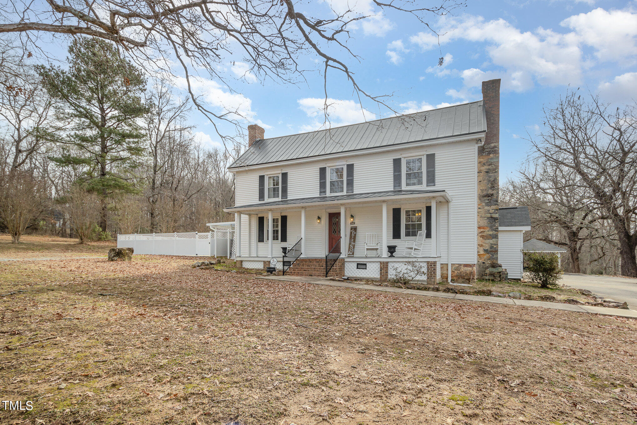 804 Bahama Road Bahama, NC 27503 - Photo 6 of 80 a front view of a house with a yard