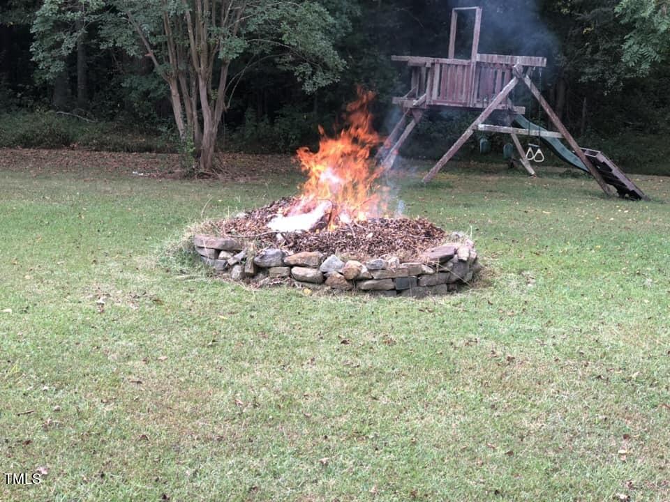 804 Bahama Road Bahama, NC 27503 - Photo 74 of 80 a backyard of a house with lots of green space