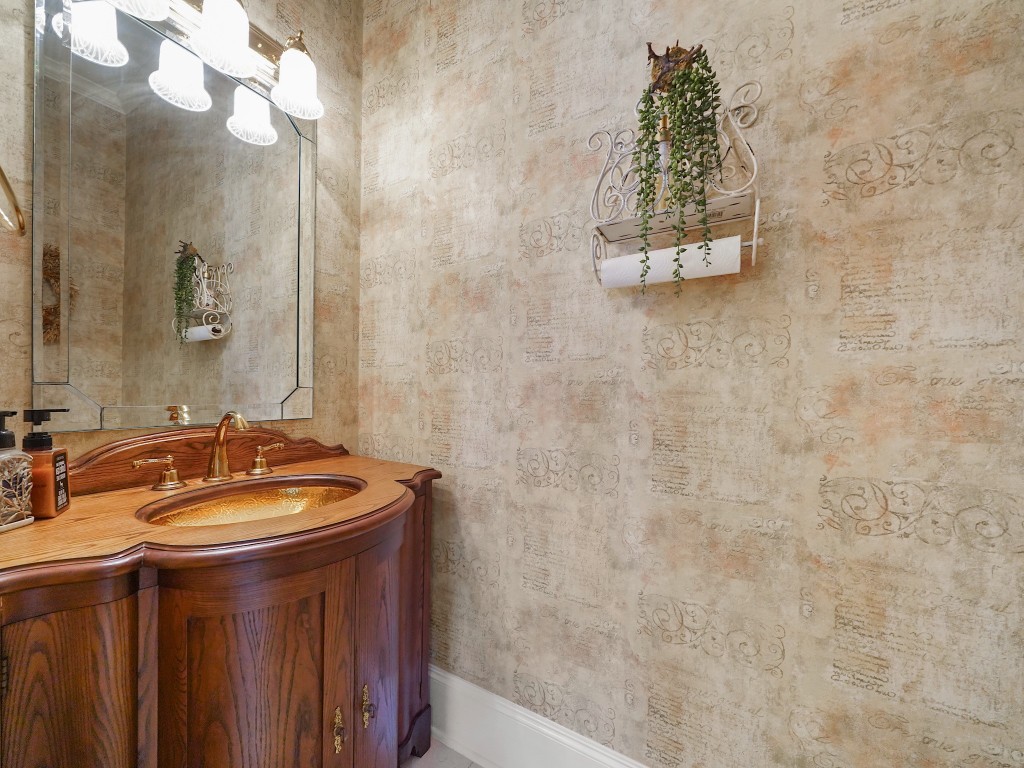 32134 Fulbrook Commons Fulshear, TX 77441 - Photo 17 of 49 A beautifully appointed powder bath just off the great room offers convenience for guests, finished with warm textures and elegant detailing.