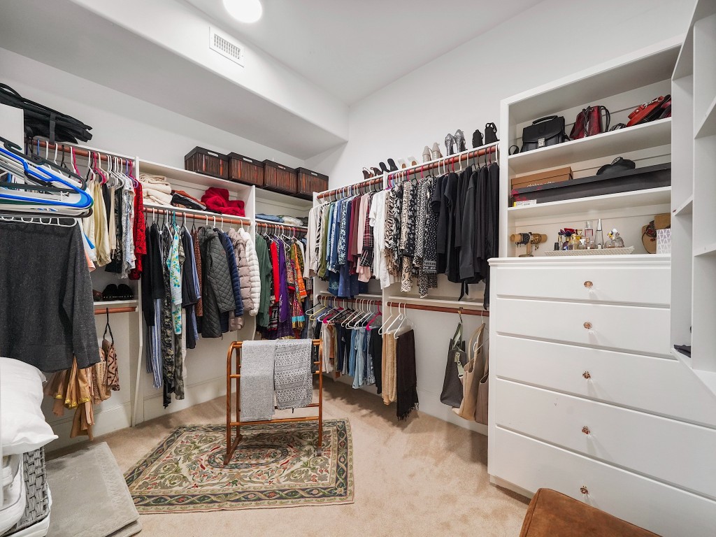 32134 Fulbrook Commons Fulshear, TX 77441 - Photo 23 of 49 The first of two expansive walk-in closets offers impressive storage and organization, thoughtfully designed to accommodate a substantial wardrobe with ease.