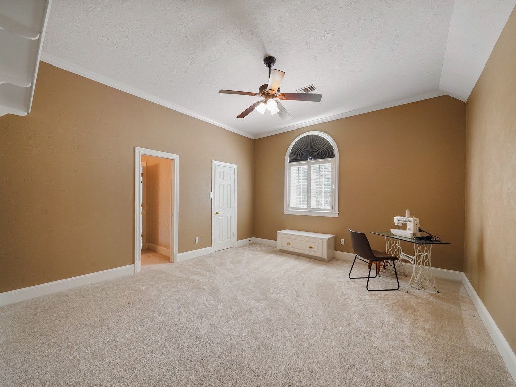 32134 Fulbrook Commons Fulshear, TX 77441 - Photo 30 of 49 This generously sized upstairs bedroom provides comfort and privacy, complete with ample space for guests or family living.