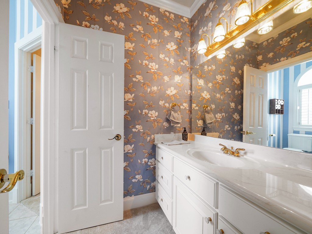 32134 Fulbrook Commons Fulshear, TX 77441 - Photo 31 of 49 A well-appointed Jack-and-Jill bathroom provides seamless access between the secondary bedrooms, featuring elegant finishes and a functional layout designed for both comfort and everyday ease.