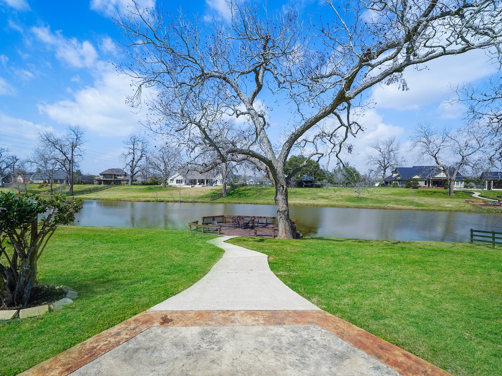 32134 Fulbrook Commons Fulshear, TX 77441 - Photo 44 of 49 The private dock offers a tranquil retreat along the shoreline — an inviting space for gathering, unwinding, and soaking in the natural beauty that surrounds this exceptional waterfront estate.