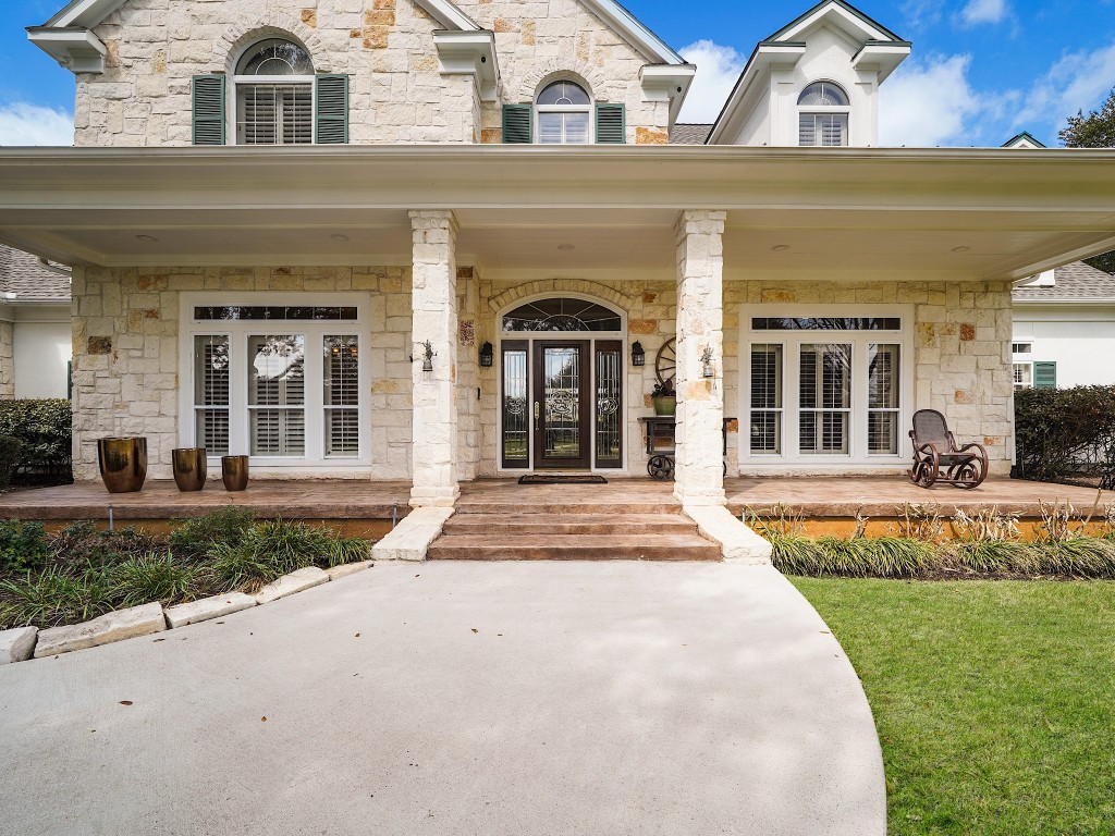32134 Fulbrook Commons Fulshear, TX 77441 - Photo 5 of 49 Classic architectural lines, a welcoming covered front porch, and refined detailing give this estate timeless curb appeal with understated sophistication.