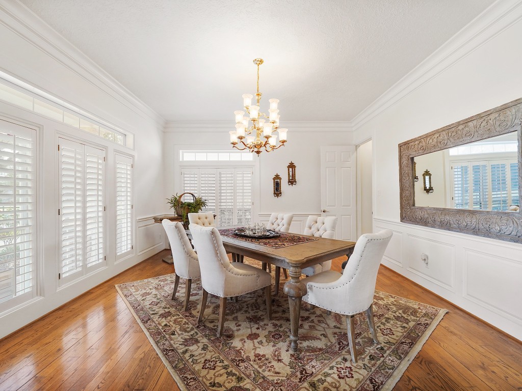 32134 Fulbrook Commons Fulshear, TX 77441 - Photo 8 of 49 The formal dining room offers refined proportions and natural light, providing an elegant backdrop for both intimate dinners and larger gatherings.