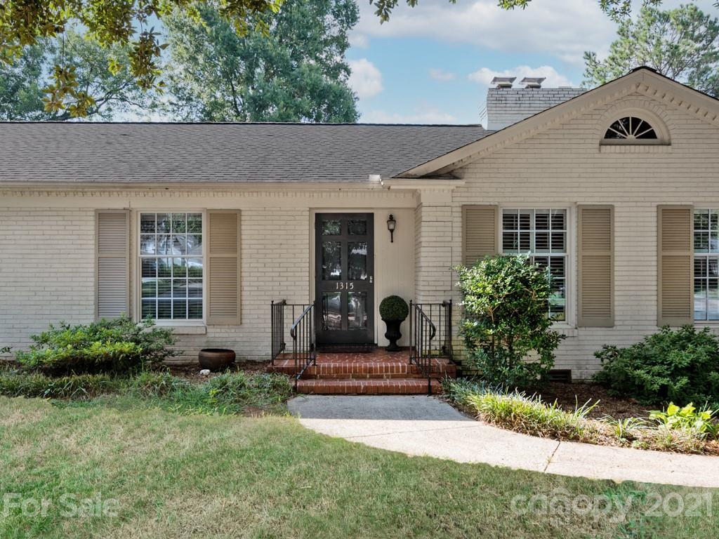 1315 Ferncliff Road Charlotte, NC 28211 - Photo 2 of 44 a front view of a house with a yard