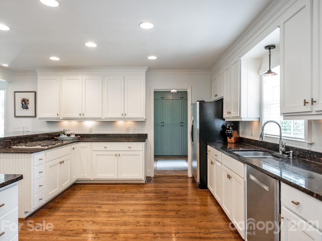 1315 Ferncliff Road Charlotte, NC 28211 - Photo 13 of 44 a large kitchen with stainless steel appliances granite countertop a stove a sink and a refrigerator