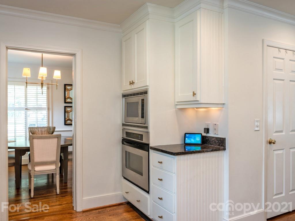 1315 Ferncliff Road Charlotte, NC 28211 - Photo 17 of 44 a kitchen with cabinets and a refrigerator