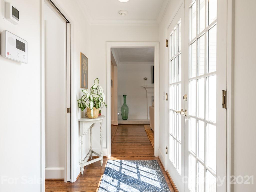 1315 Ferncliff Road Charlotte, NC 28211 - Photo 23 of 44 a view of a hallway with wooden floor and windows