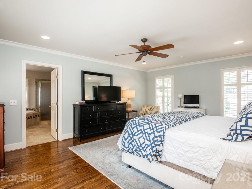 1315 Ferncliff Road Charlotte, NC 28211 - Photo 25 of 44 a bedroom with a bed and a flat screen tv