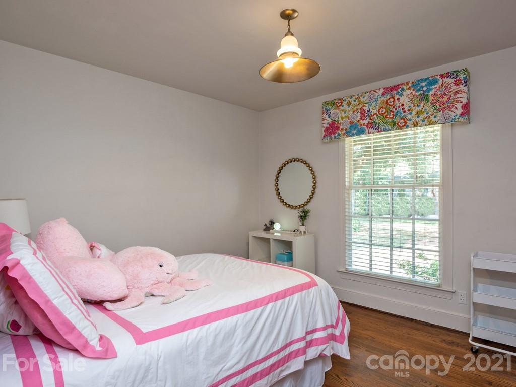 1315 Ferncliff Road Charlotte, NC 28211 - Photo 28 of 44 a bedroom with a bed and a window
