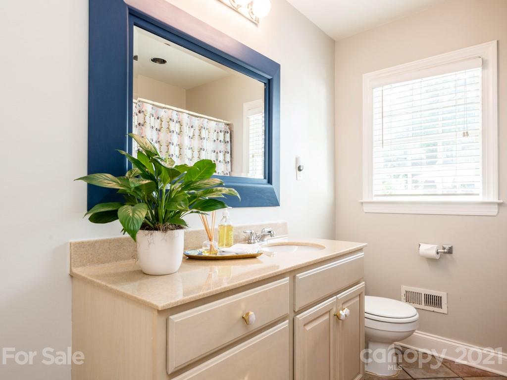 1315 Ferncliff Road Charlotte, NC 28211 - Photo 30 of 44 a white sink sitting next to a white toilet