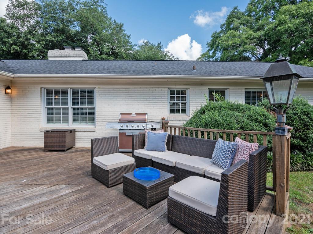 1315 Ferncliff Road Charlotte, NC 28211 - Photo 36 of 44 a view of a patio with couches chairs and wooden floor