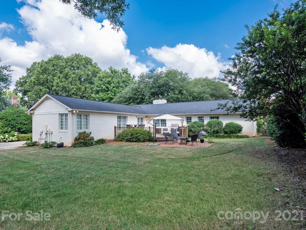 1315 Ferncliff Road Charlotte, NC 28211 - Photo 38 of 44 a view of a house with backyard sitting area and garden