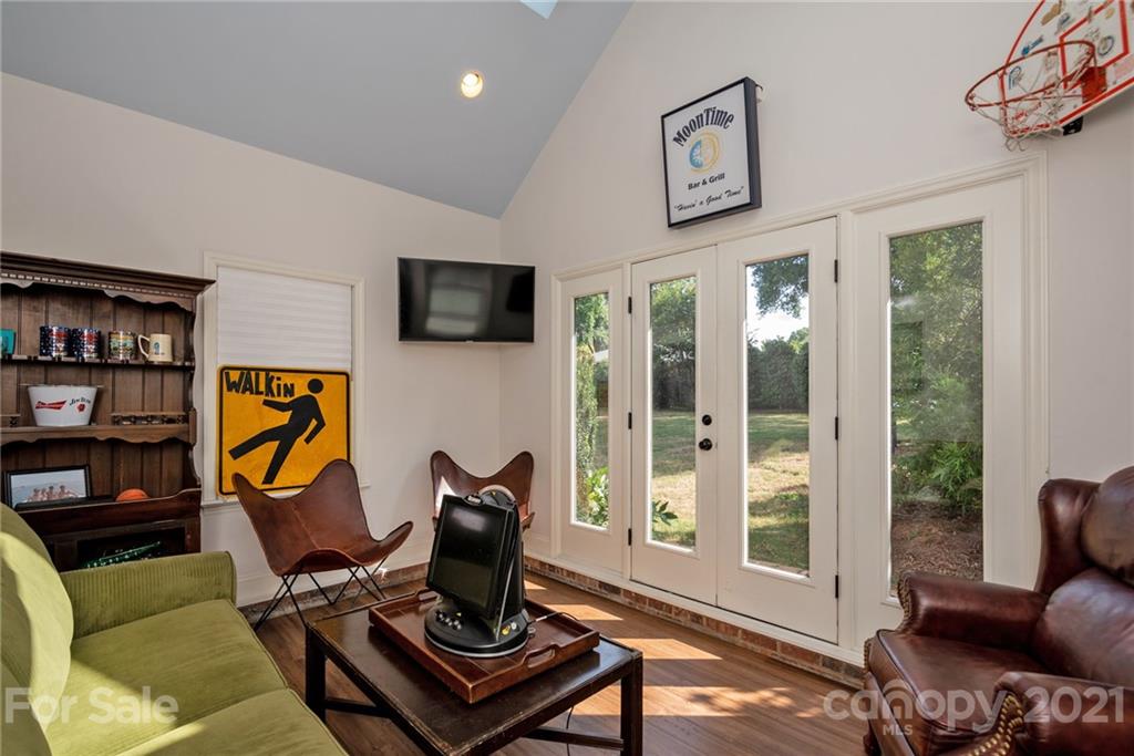 1315 Ferncliff Road Charlotte, NC 28211 - Photo 41 of 44 a living room with furniture a flat screen tv and a window