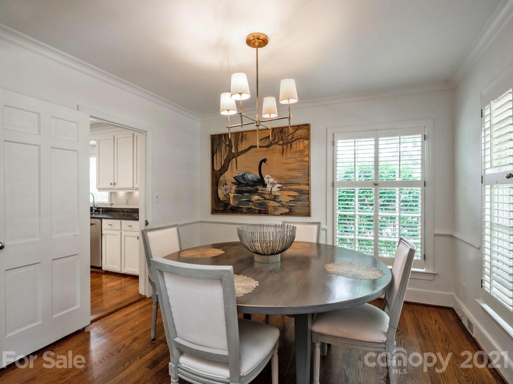 1315 Ferncliff Road Charlotte, NC 28211 - Photo 9 of 44 a view of a dining room with furniture window and wooden floor