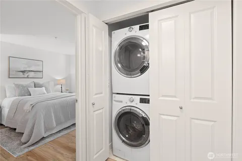 a view of a bedroom with washer and dryer