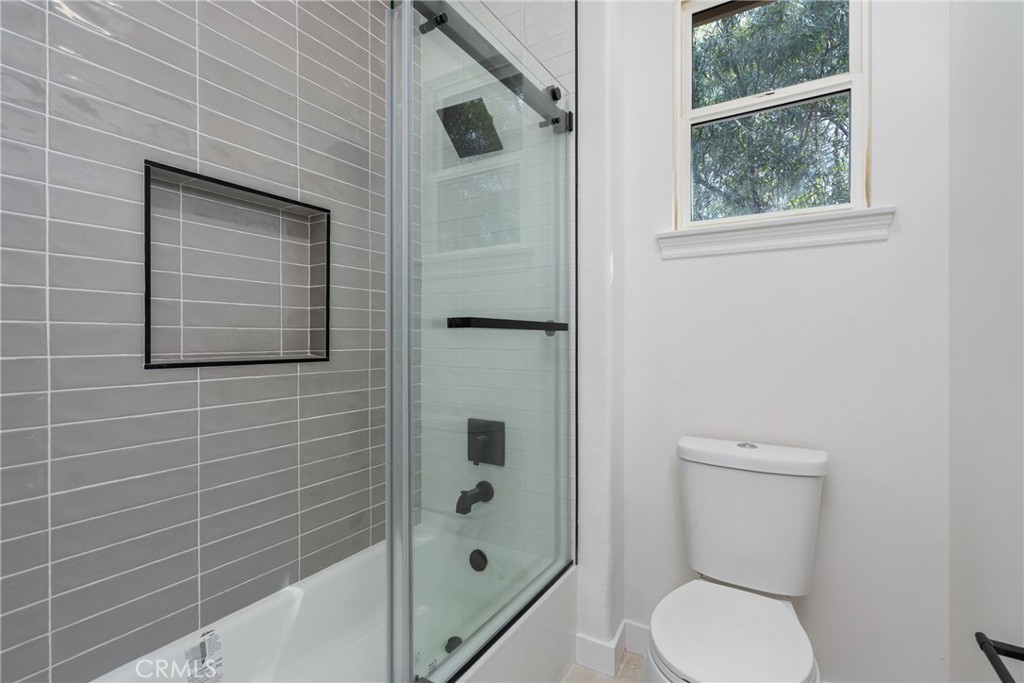 17741 Laurel Grove Road Riverside, CA 92504 - Photo 19 of 62 a bathroom with a toilet and a shower