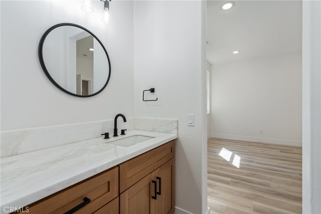 17741 Laurel Grove Road Riverside, CA 92504 - Photo 20 of 62 a bathroom with a sink and a mirror