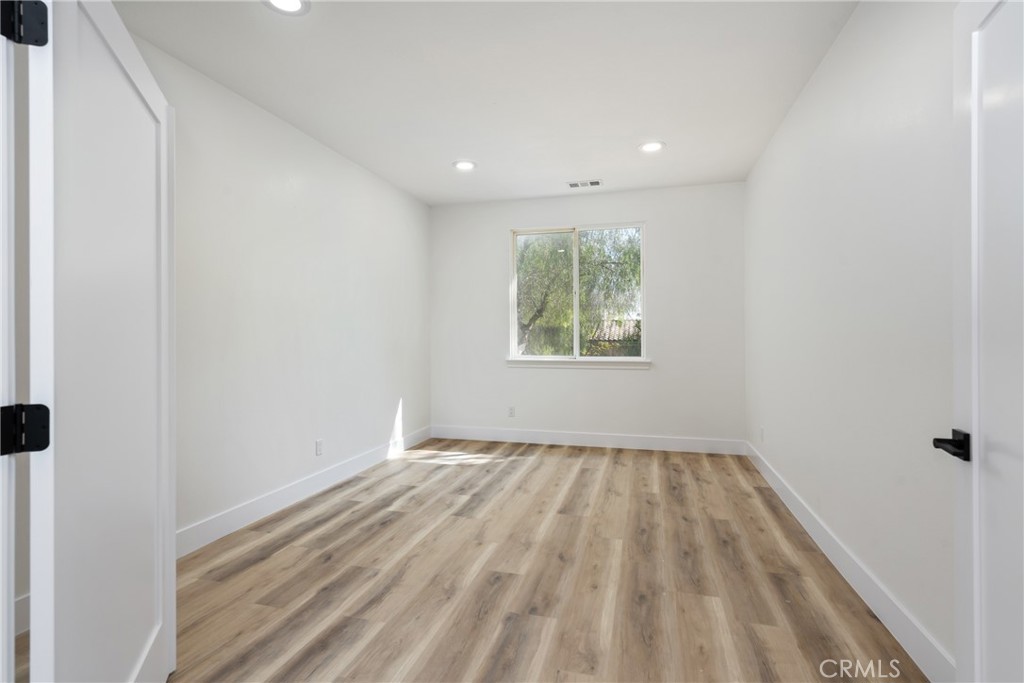 17741 Laurel Grove Road Riverside, CA 92504 - Photo 25 of 62 a view of room with window and hardwood floor