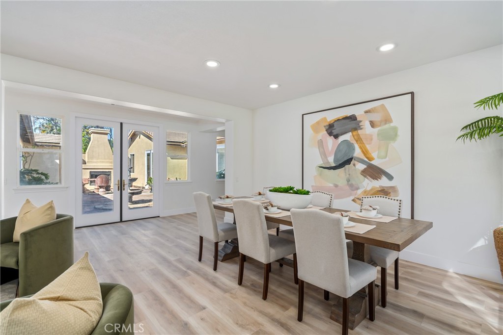 17741 Laurel Grove Road Riverside, CA 92504 - Photo 33 of 62 a view of a dining room with furniture window and wooden floor