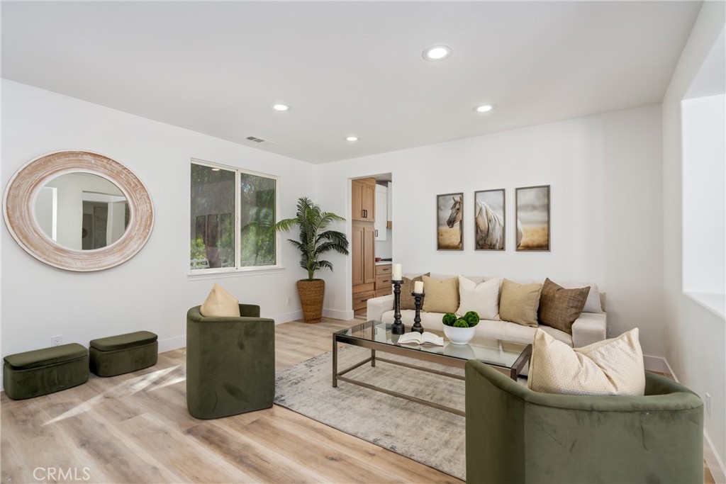 17741 Laurel Grove Road Riverside, CA 92504 - Photo 36 of 62 a living room with furniture and a potted plant