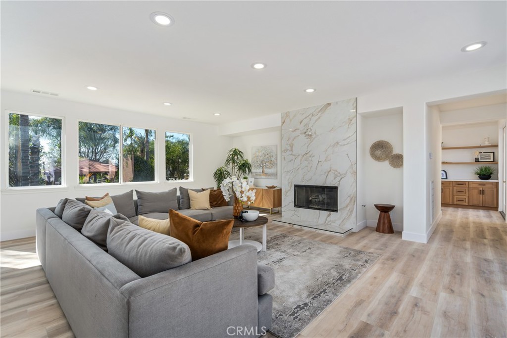17741 Laurel Grove Road Riverside, CA 92504 - Photo 37 of 62 a living room with furniture large window and a fireplace