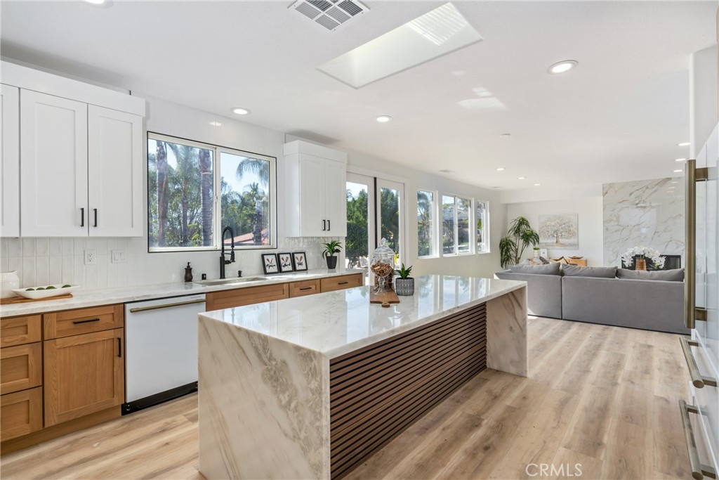 17741 Laurel Grove Road Riverside, CA 92504 - Photo 45 of 62 a large kitchen with stainless steel appliances lots of counter space and a sink
