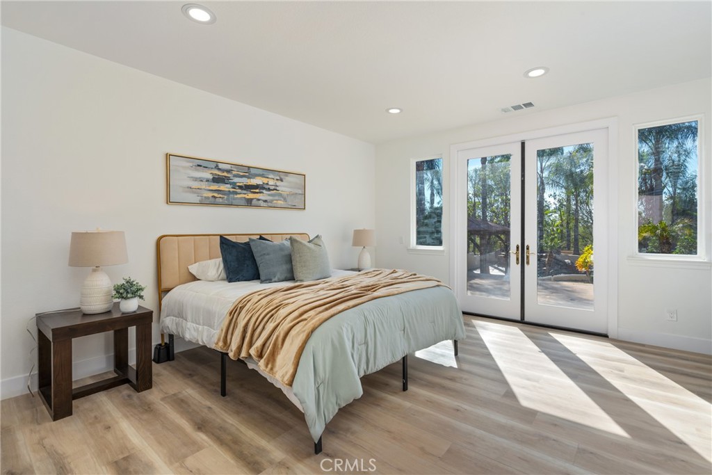 17741 Laurel Grove Road Riverside, CA 92504 - Photo 48 of 62 a spacious bedroom with a bed and a large window