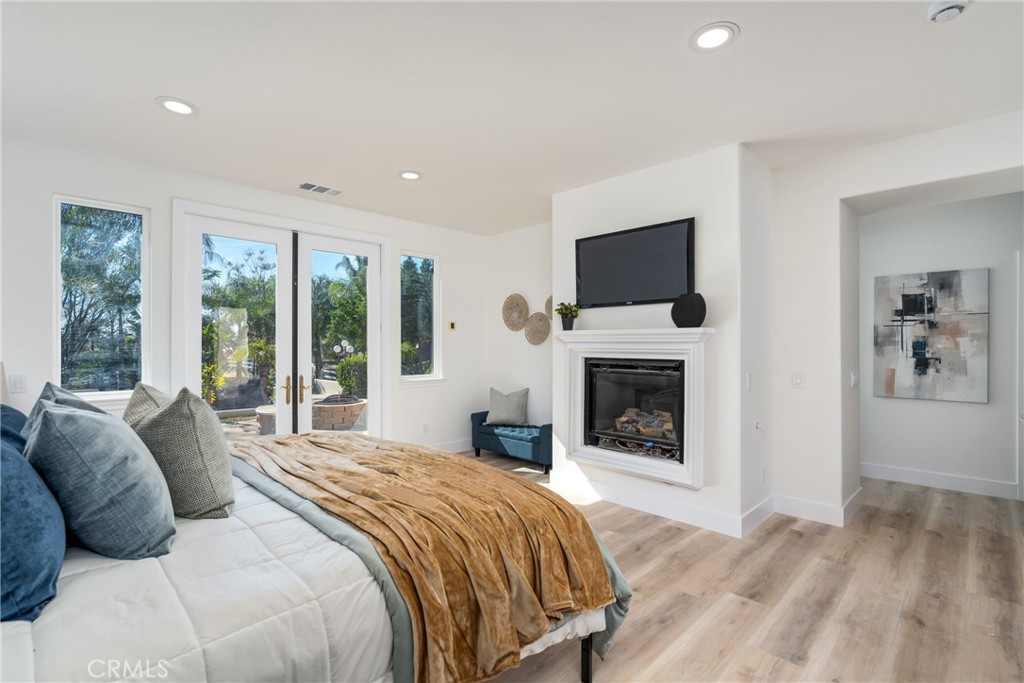 17741 Laurel Grove Road Riverside, CA 92504 - Photo 49 of 62 a bedroom with a bed and a fireplace