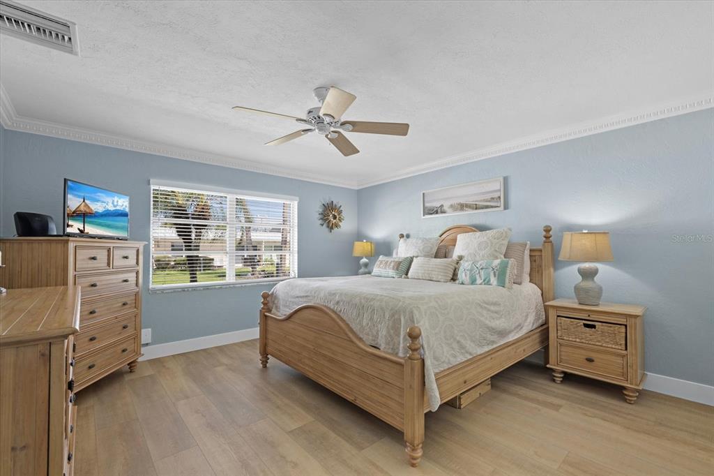 5830 Midnight Pass Road, Unit 52 Sarasota, FL 34242 - Photo 11 of 32 a bedroom with a bed and a window