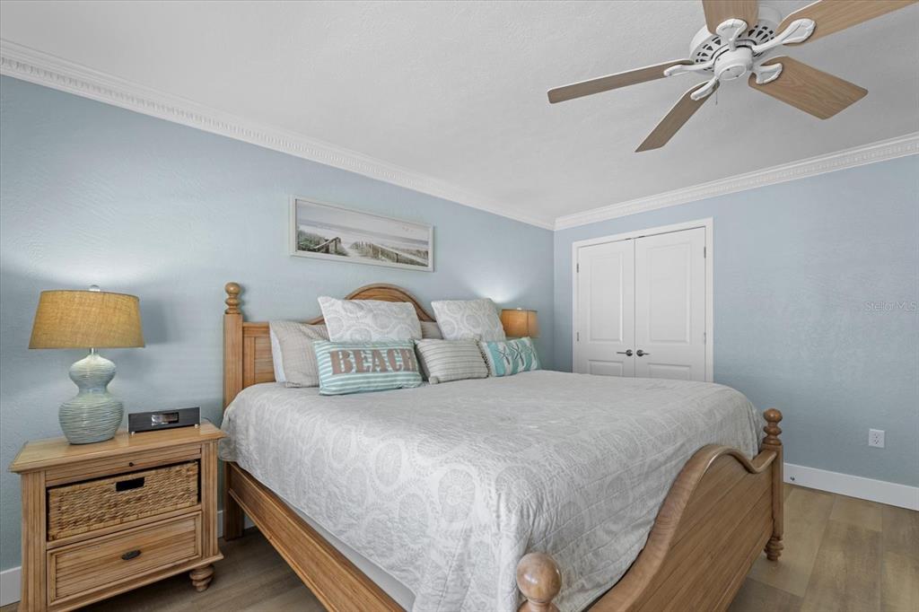 5830 Midnight Pass Road, Unit 52 Sarasota, FL 34242 - Photo 13 of 32 a bedroom with a bed and window