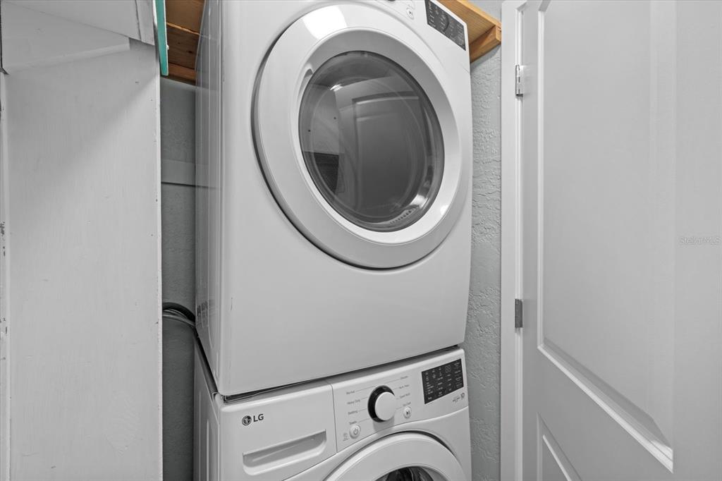 5830 Midnight Pass Road, Unit 52 Sarasota, FL 34242 - Photo 16 of 32 a close up view of a washer and dryer