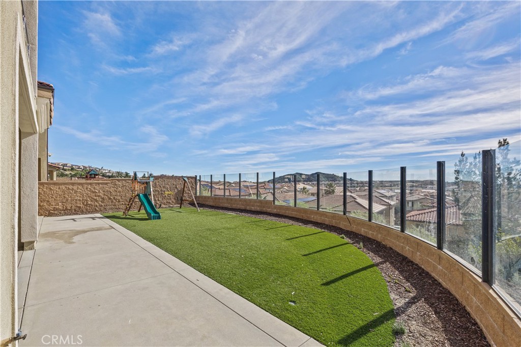 20638 Deer Grass Court Porter Ranch, CA 91326 - Photo 3 of 50 a view of a swimming pool with a garden