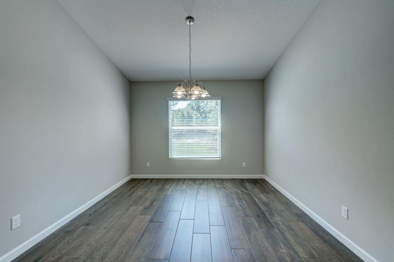 444 Southwest Log Drive Port St. Lucie, FL 34953 - Photo 14 of 54 a view of room window and wooden floor
