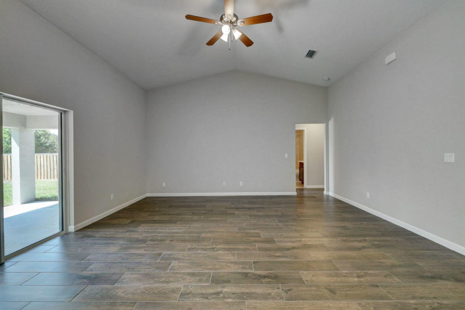 444 Southwest Log Drive Port St. Lucie, FL 34953 - Photo 16 of 54 a view of an empty room with a window