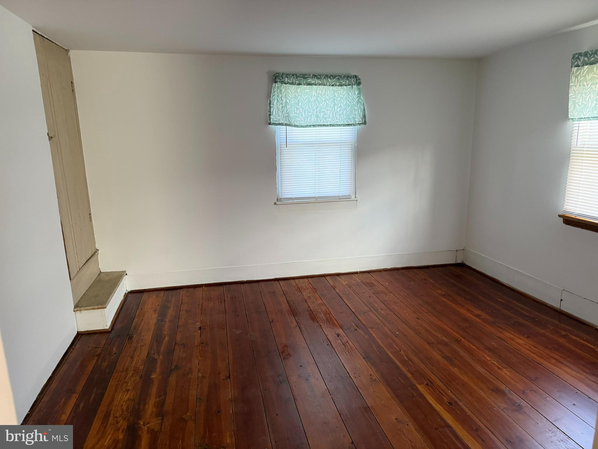 430 Isaac Budd Road Southampton, NJ 08088 - Photo 20 of 23 an empty room with wooden floor and windows