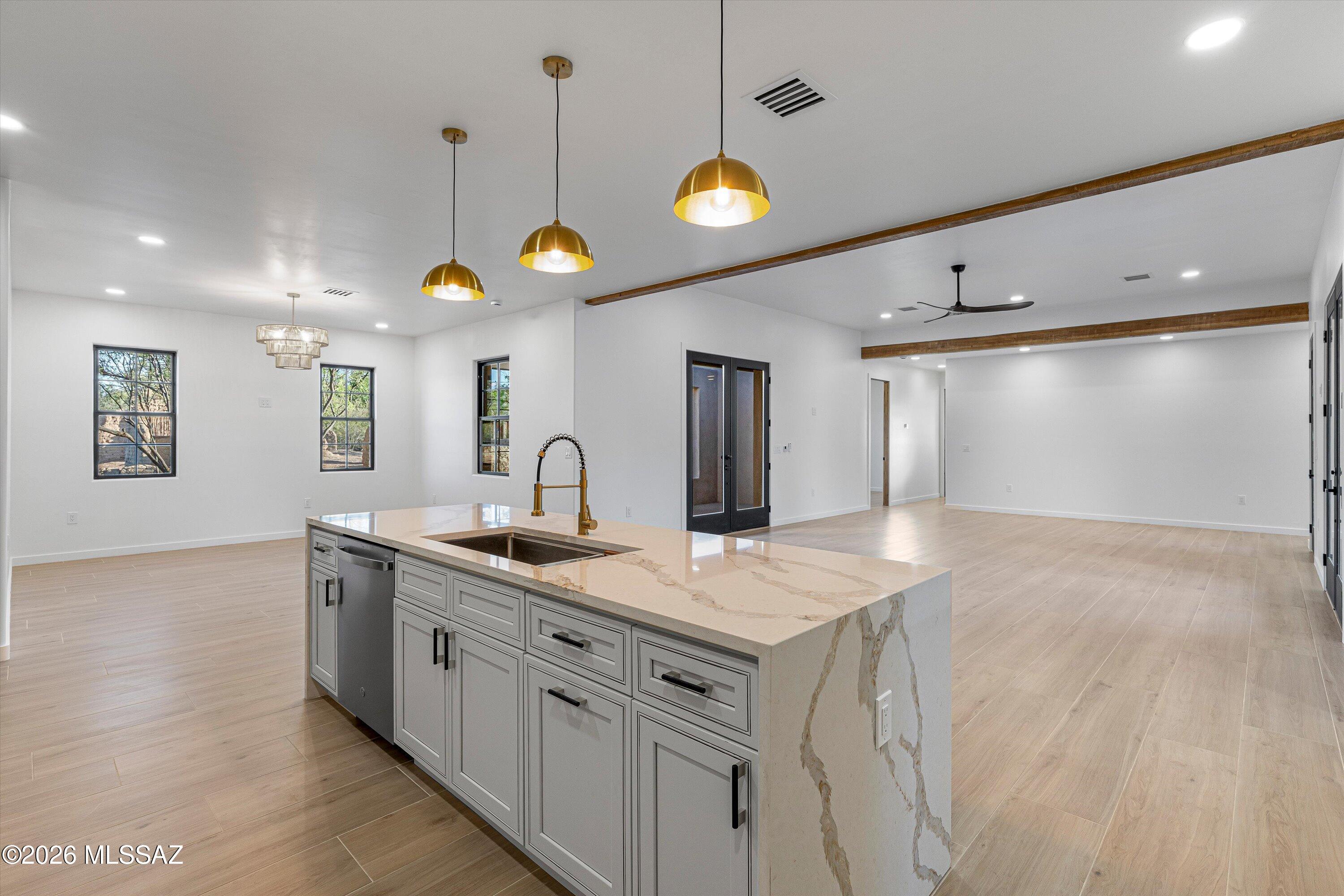 5259 East Fort Lowell Road Tucson, AZ 85712 - Photo 15 of 50 a kitchen with a sink and chandelier