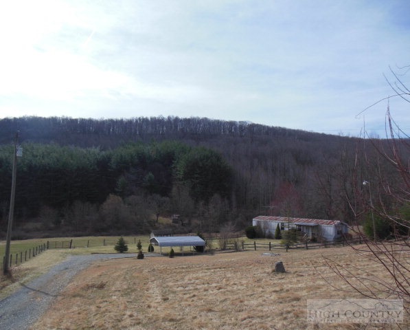 an aerial view of a a yard with mountain