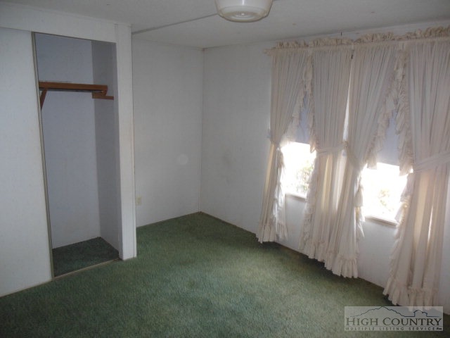 522 Quincy Road Sparta, NC 28675 - Photo 15 of 20 a view of an empty room and window