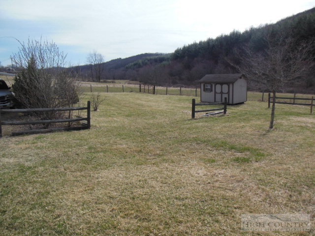522 Quincy Road Sparta, NC 28675 - Photo 6 of 20 a view of lake with mountain