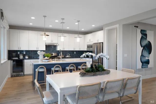 a kitchen with a table and chairs in it