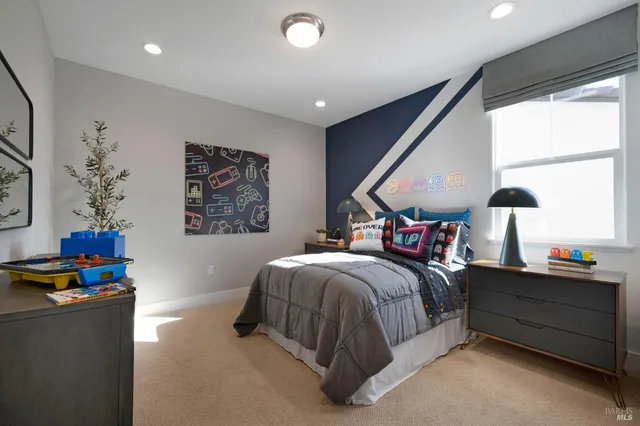 a bedroom with a bed and window